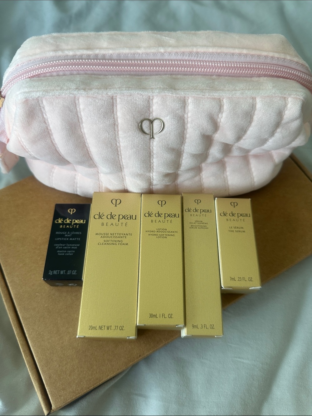 cle de peau Pink Quilted Cosmetic Pouch with Gold Skincare Boxes